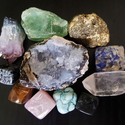 Healing Crystal Collection Raw Stones and Tumbles on a flat surface